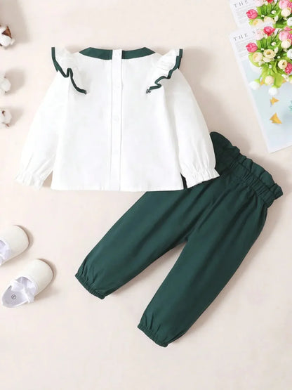 Toddler two-piece cotton outfit with bow and ruffles