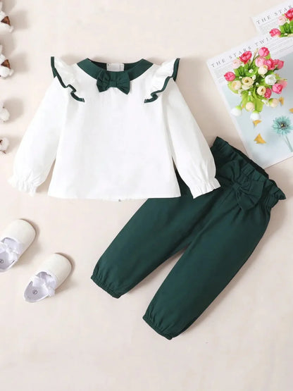 Toddler two-piece cotton outfit with bow and ruffles